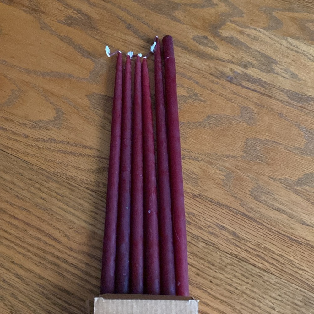 Cranberry tall thin tapered candles. Box of 6.